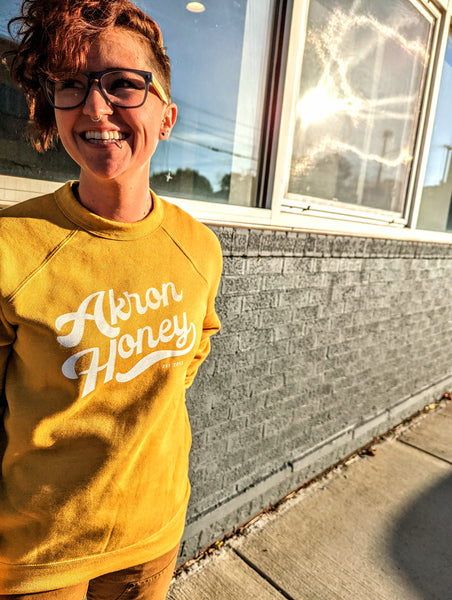 Yellow sweatshirt that store says honey